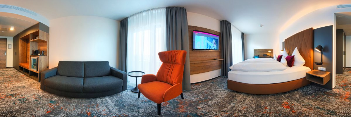 Zimmer in Emils Hotel gemütliches Zimmer mit großem Bett